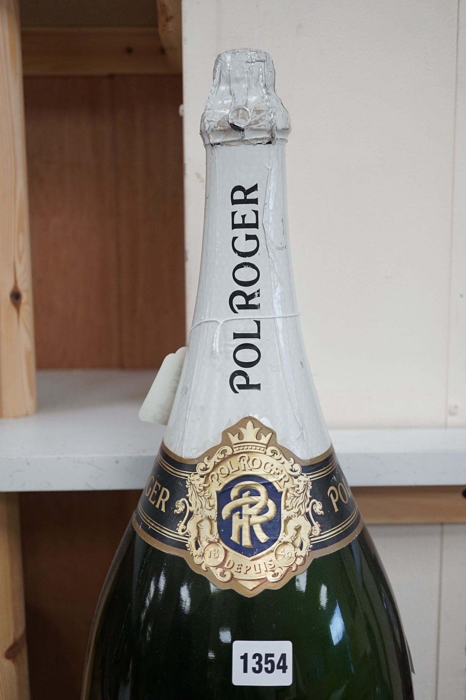 A vacant Nebuchadnezzar bottle of Pol Roger reserve champagne, 72cm high